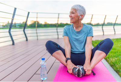 woman sitting on yoga mat