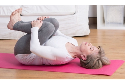 stretching lower back on mat