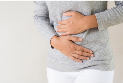 woman having painful stomachache