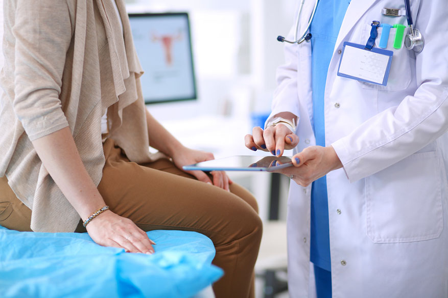 doctor reviewing charts with patient