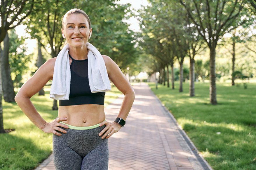 happy sporty woman in sportswear