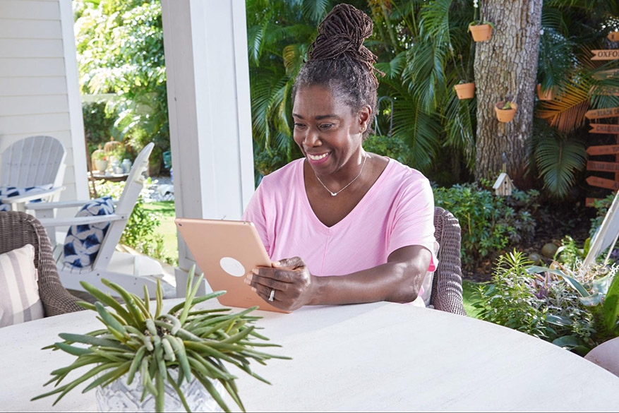 happy woman on ipad