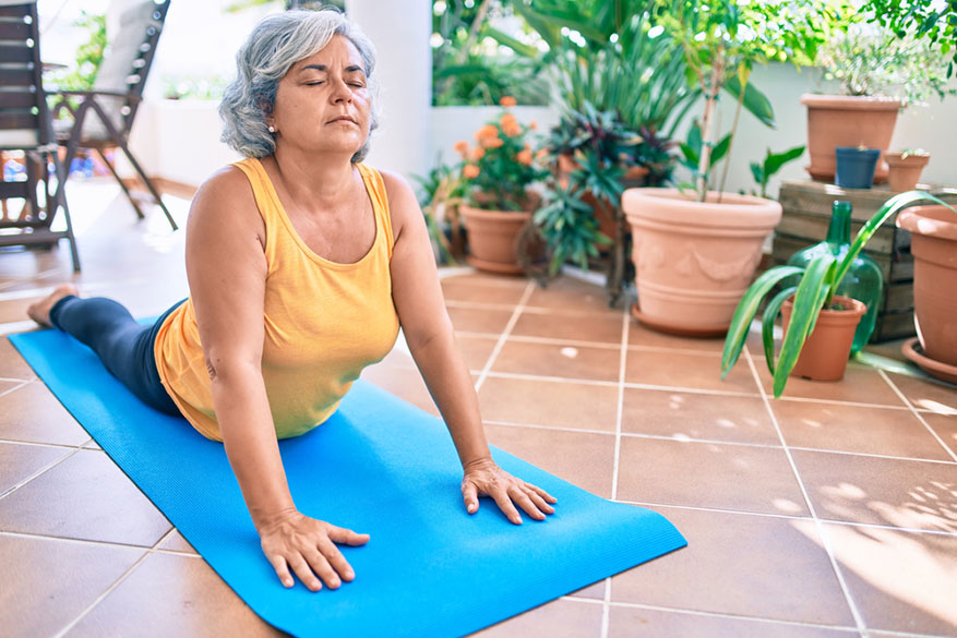 middle age woman doing yoga