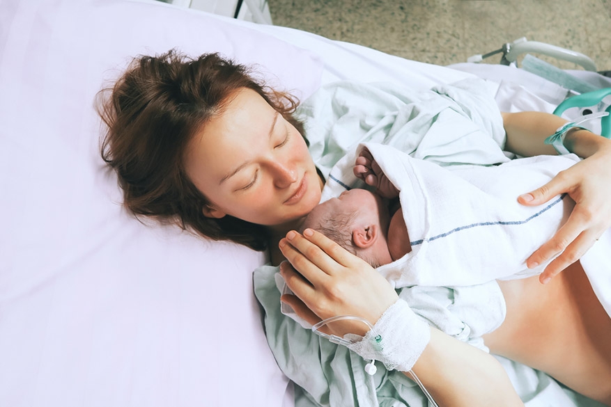 mother holding her newborn baby