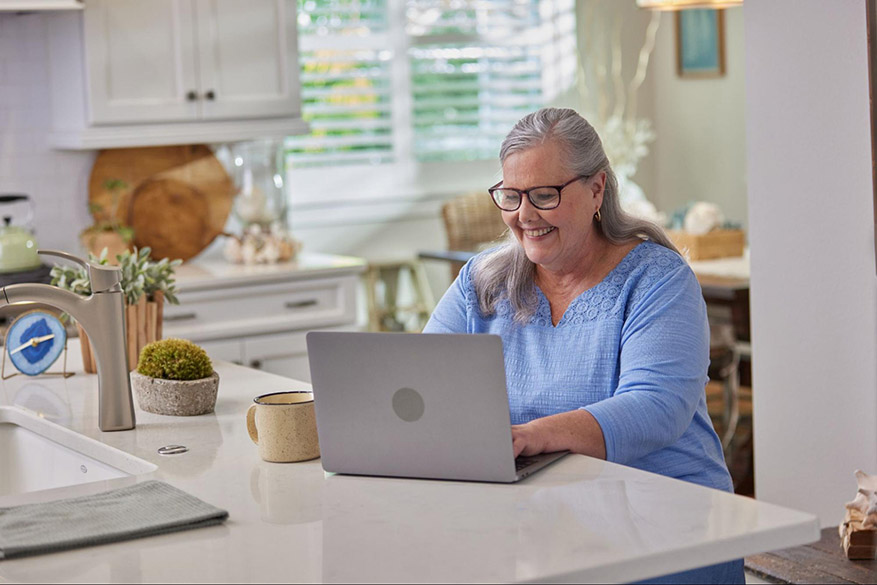 older woman at a computer