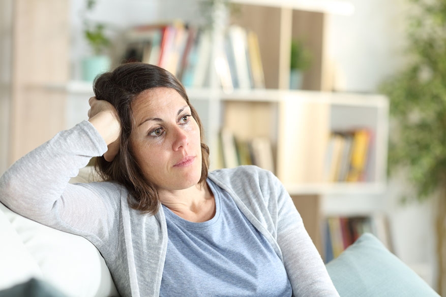 portrait of woman thinking at home