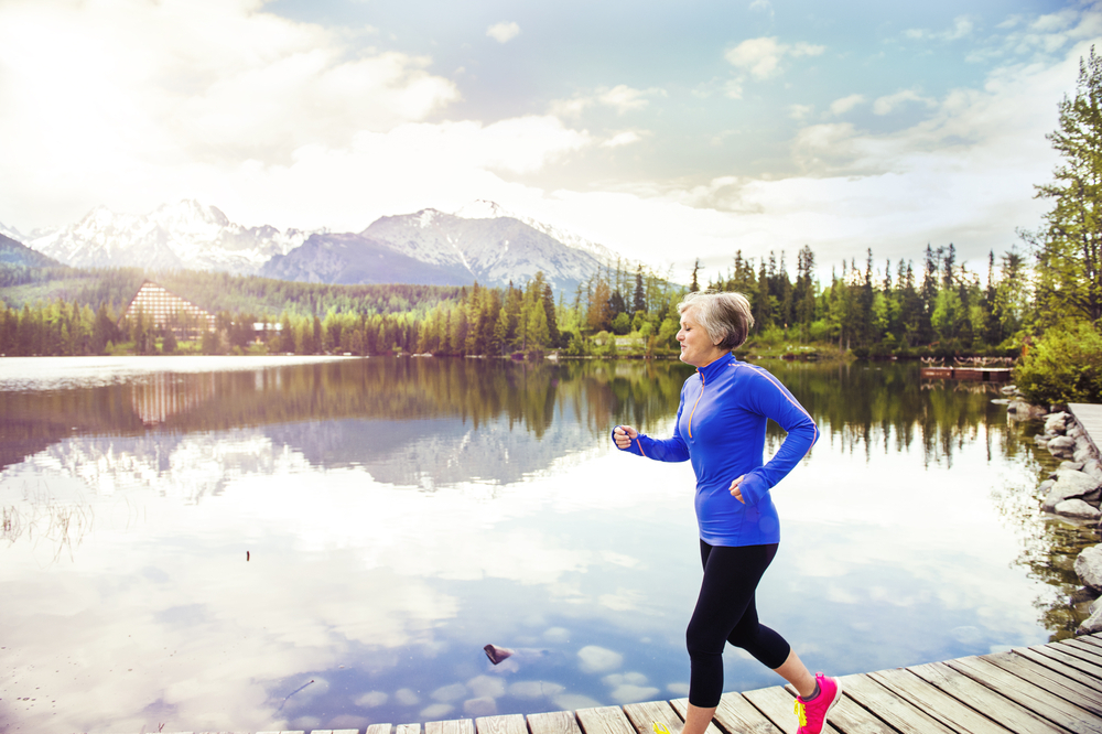 woman running around lake