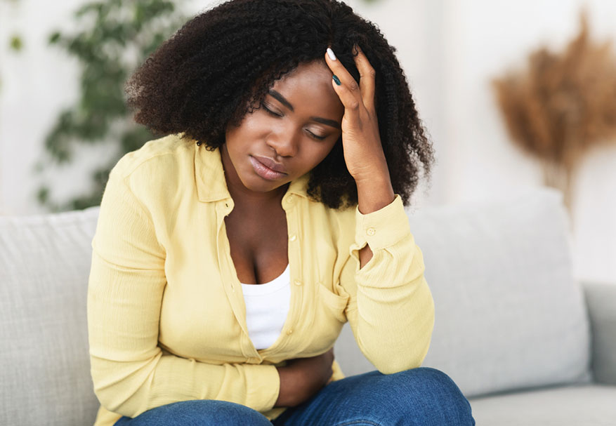 stressed out woman holding head