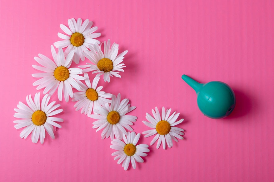 vaginal cleansing tool and daisies