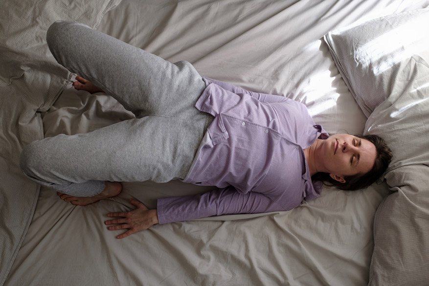 woman doing ardha chakrasana yoga pose