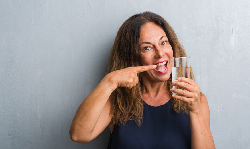 woman drinking a glass of water