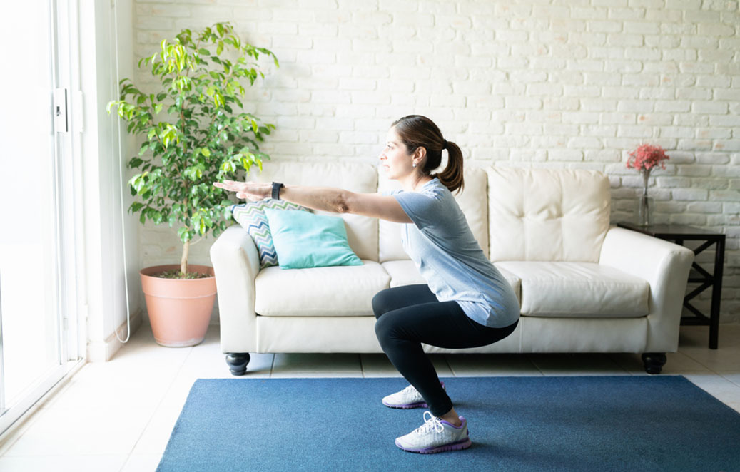 woman exercising doing squats