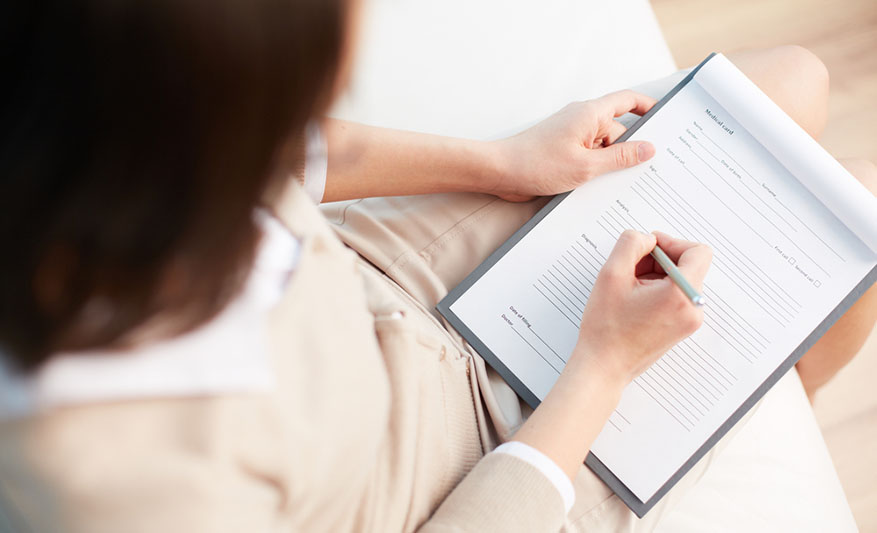 woman filling out medical questionnaire