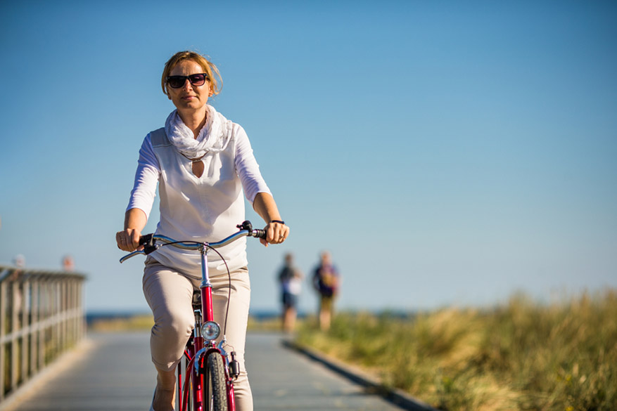 woman riding bike outdoors