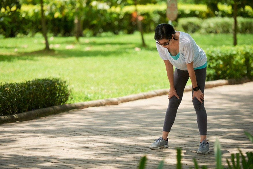 woman stopping to catch breath